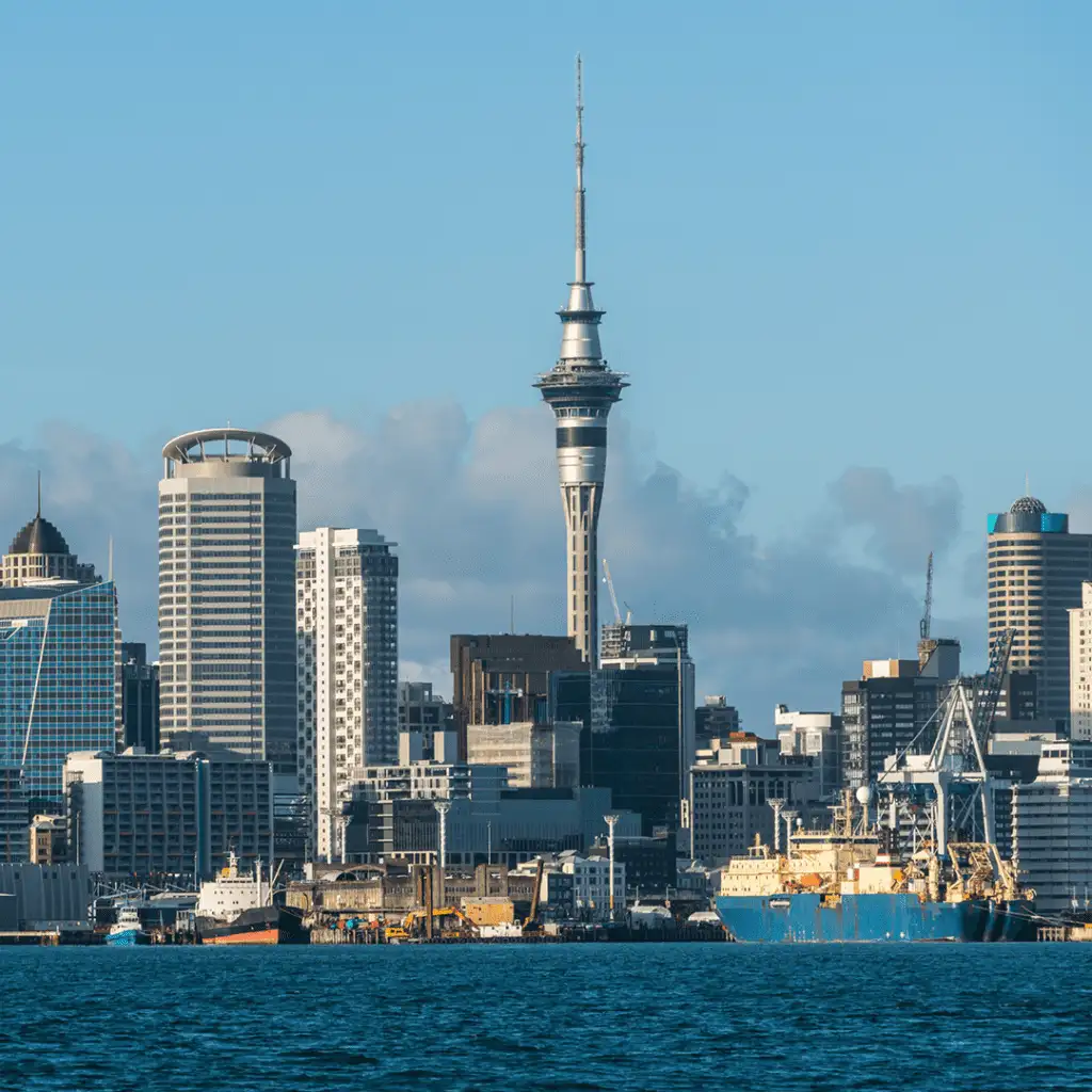 Scenic country image of New Zealand, featuring stunning landscapes, vibrant cities, and iconic landmarks like the Southern Alps and Auckland skyline.