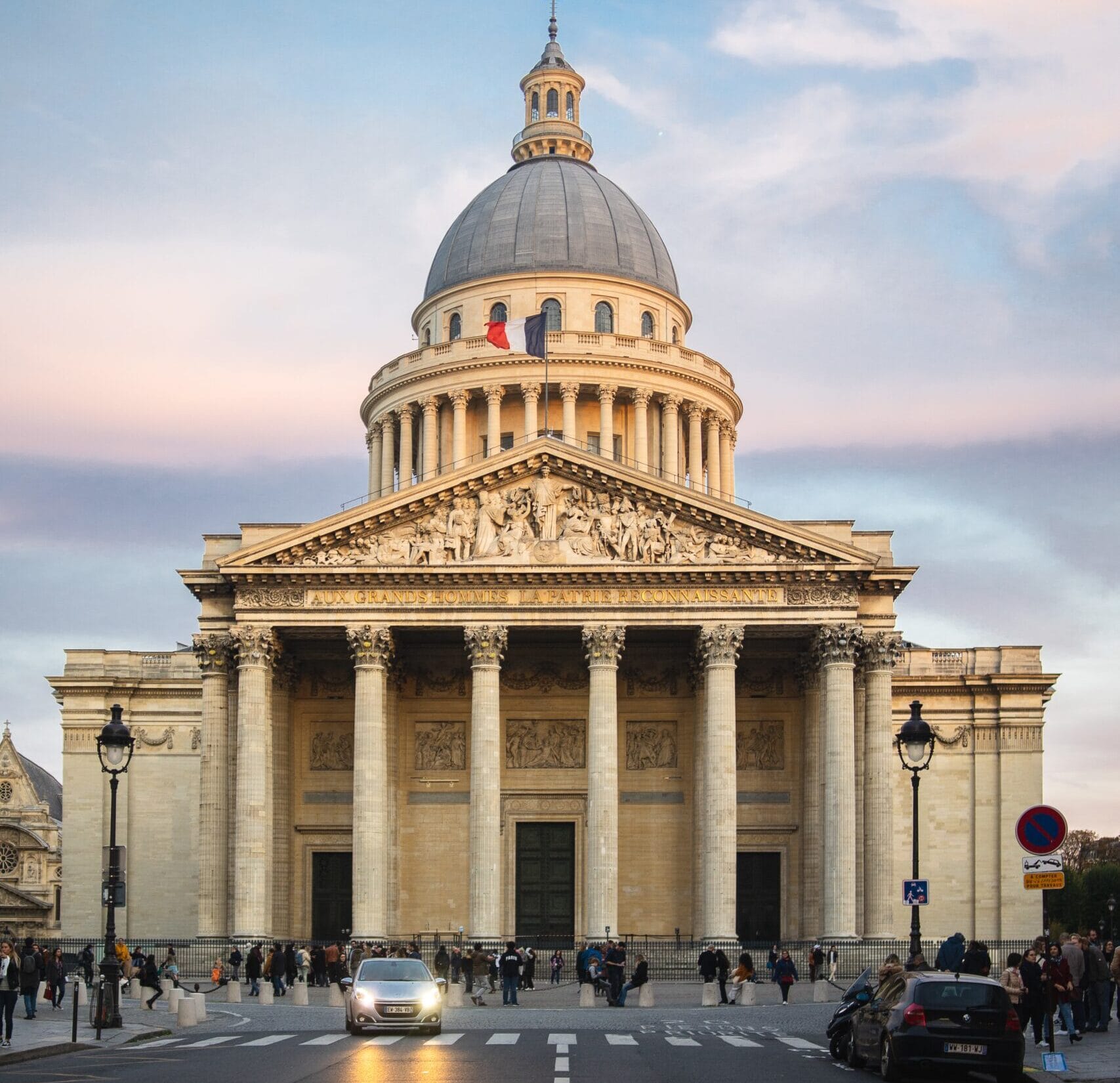 pantheon surrounded by people cloudy sky sunset paris france scaled e1785746349346